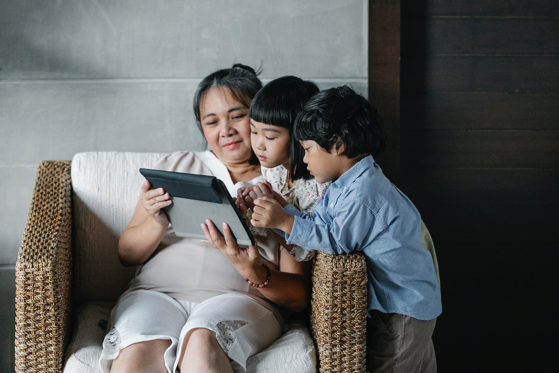 calm asian mother resting at home with kids