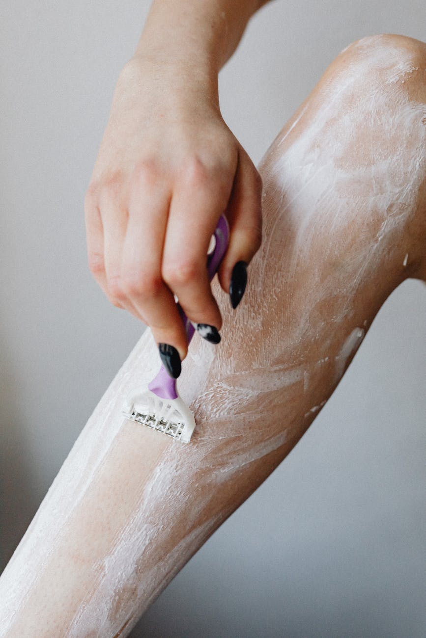 woman shaving leg