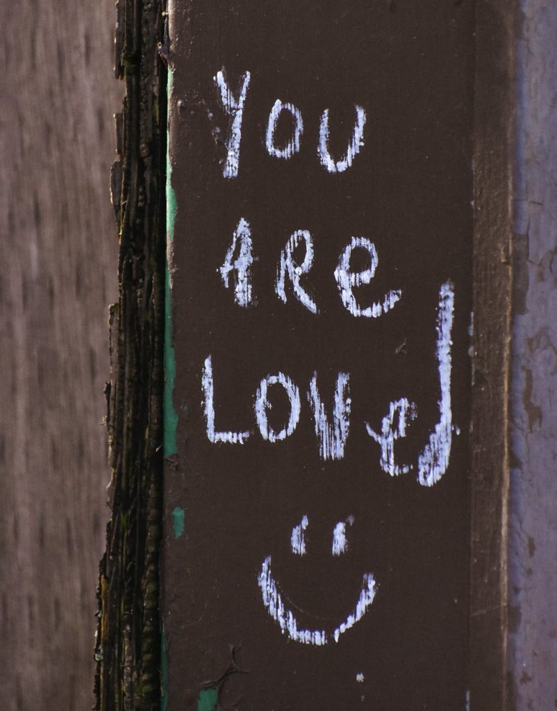 wooden plank with inscription written with chalk